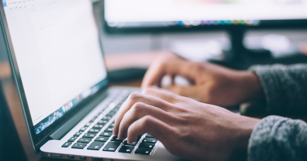 Person typing on laptop